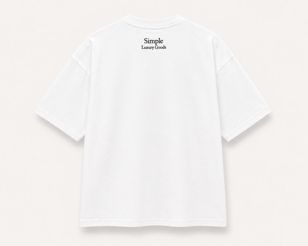 A white, slightly oversized, short-sleeve t-shirt shown from the back, featuring the text 'Simple Luxury Goods' embroidered in black at the center of the upper back, set against a light beige background.