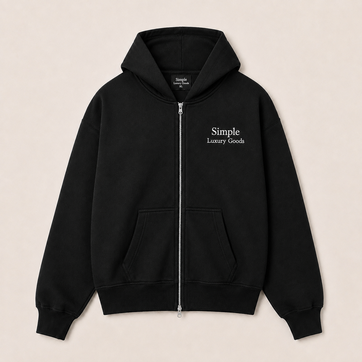 A heavyweight black double zip-up hoodie with a white embroidered logo reading 'Simple Luxury Goods' on the left chest, displayed flat against a light beige background.