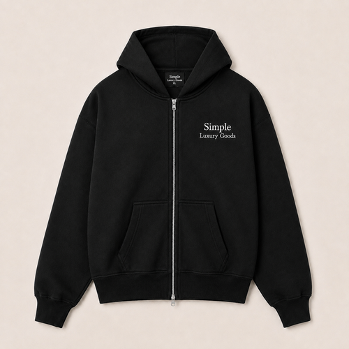 A heavyweight black double zip-up hoodie with a white embroidered logo reading 'Simple Luxury Goods' on the left chest, displayed flat against a light beige background.